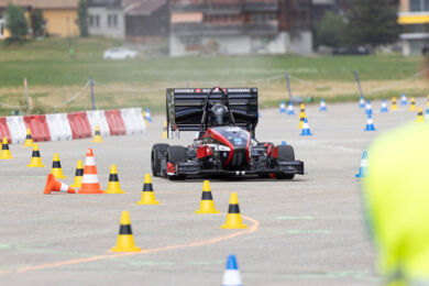 AMZ Nera racing through cones during the race. AMZ Racing Car Nera during the race