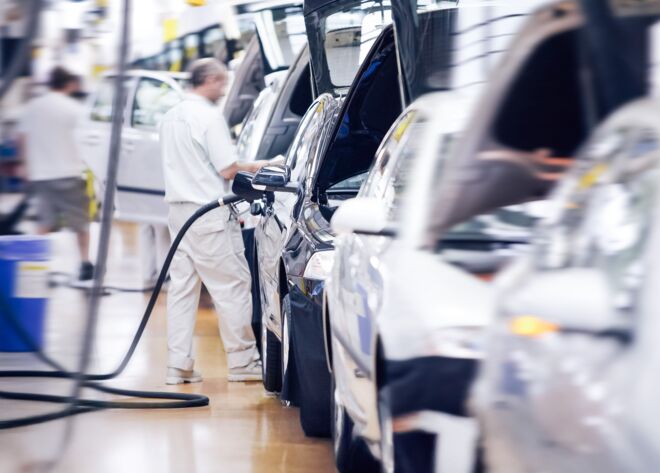 Man working in automotive production line Automotive production line